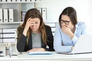Even Slight Accounting and Bookkeeping Oversights Have Consequences | Sensible Services ABC in Hammond, LA. Image of two worried women in the office discovering a mistake in a financial document.